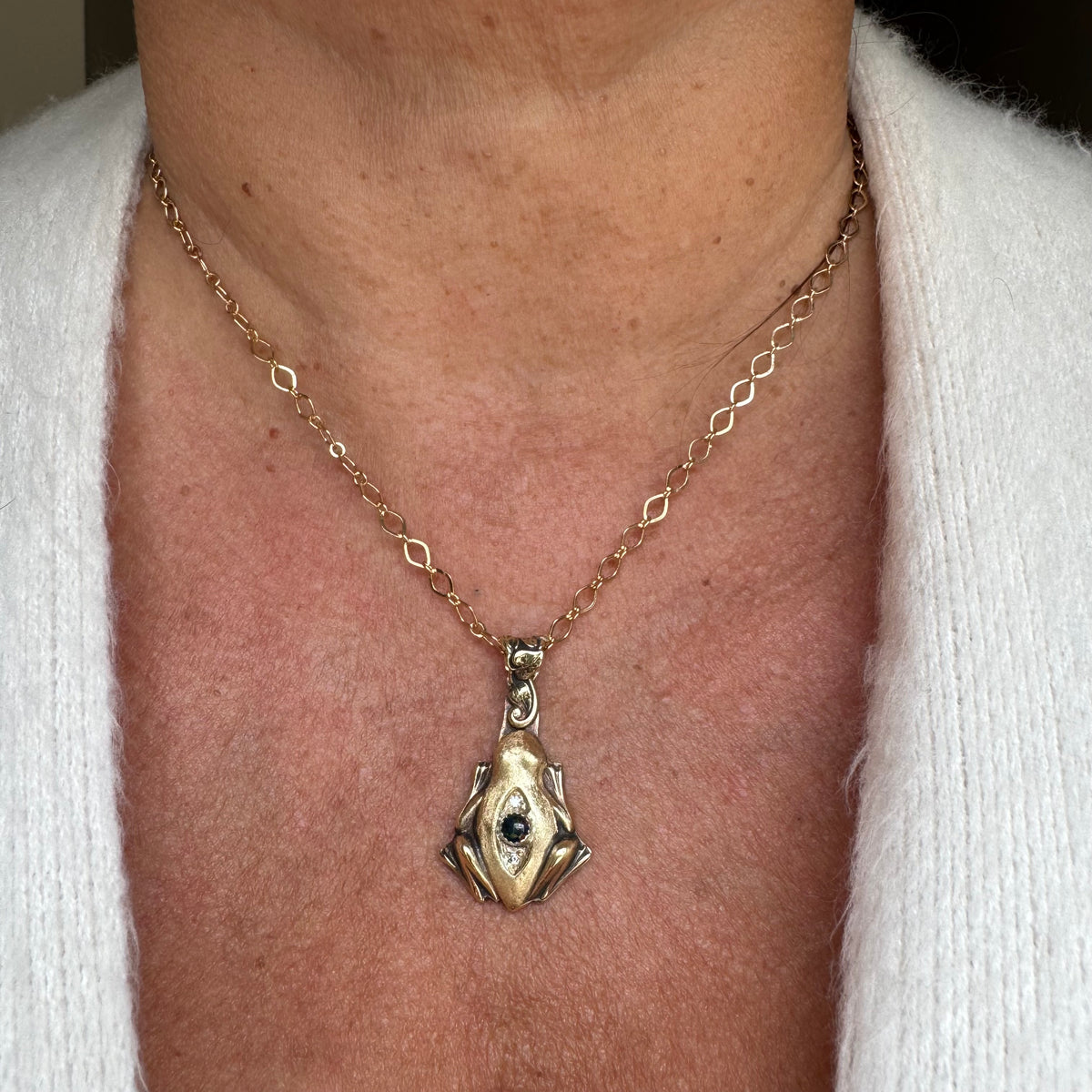 Artisan Frog Black Kyocera Opal and Moissanite necklace in Brass