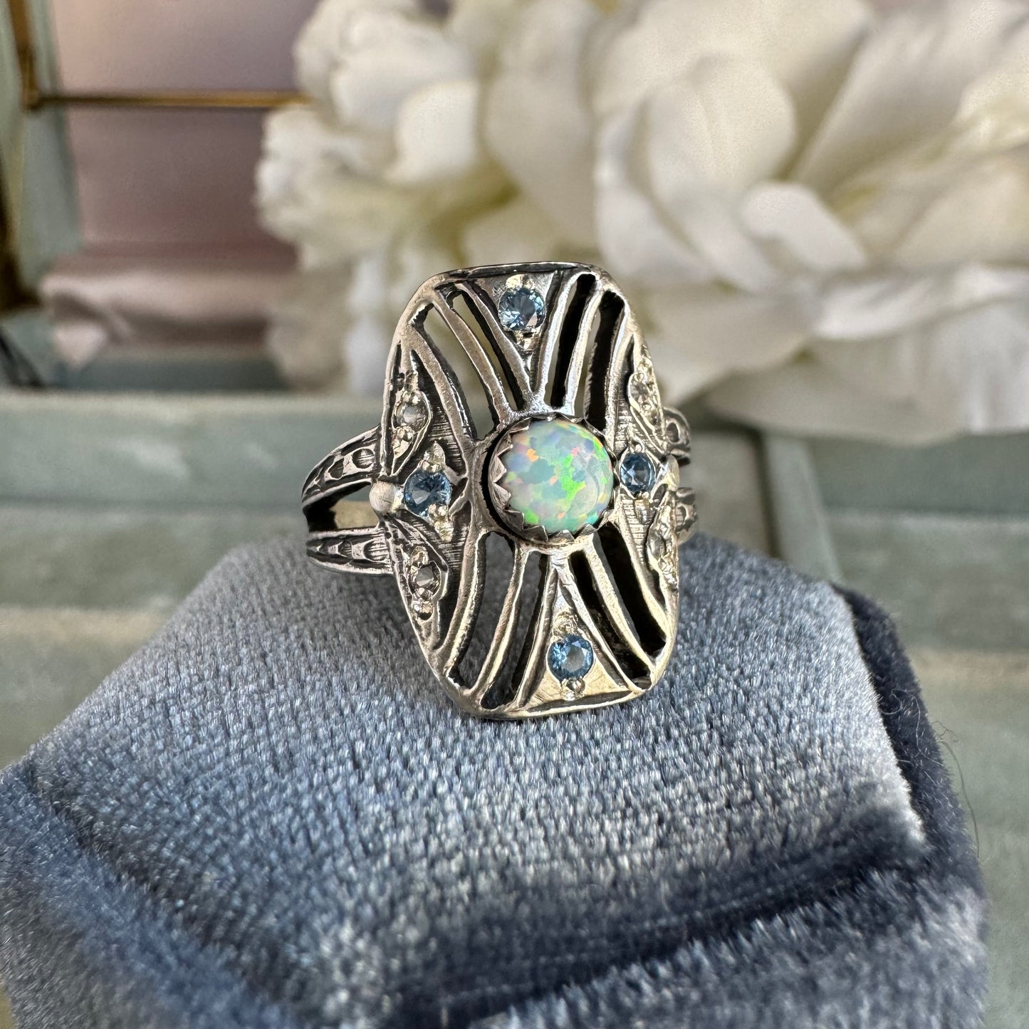 Art Deco Kyocera Opal, Blue Zircon, and White Sapphire artisan cigar band cocktail ring in Sterling Silver