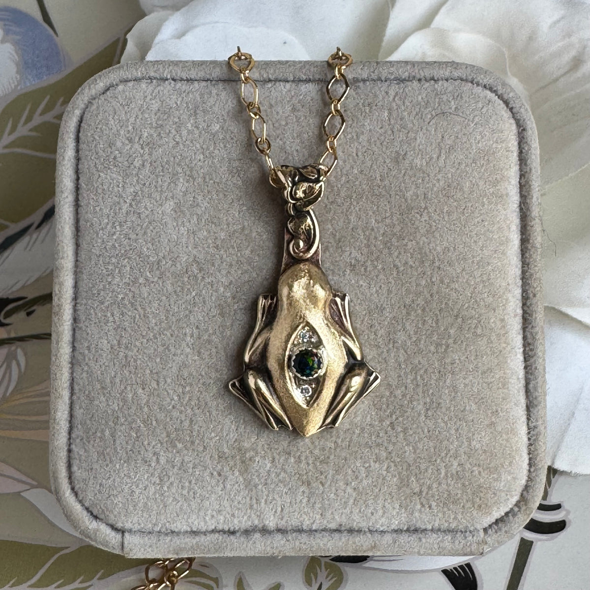 Artisan Frog Black Kyocera Opal and Moissanite necklace in Brass
